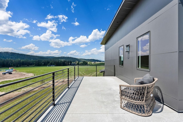 165 River Ranch Rd, Whitefish, MT 59937 - balcony featuring a rural view and a view of trees