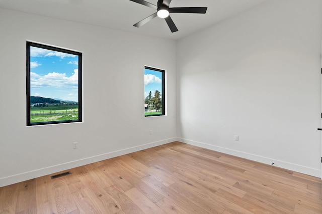 165 River Ranch Rd, Whitefish, MT 59937 - spare room with healthy amount of natural light, baseboards, a ceiling fan, and light wood-type flooring