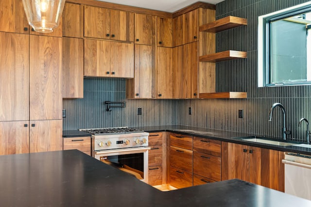 165 River Ranch Rd, Whitefish, MT 59937 - kitchen with open shelves, stainless steel stove, a sink, tasteful backsplash, and dishwashing machine