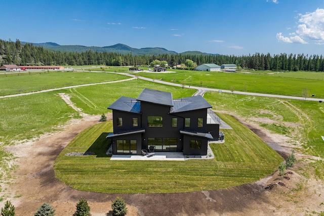 165 River Ranch Rd, Whitefish, MT 59937 - view of rural area with a mountainous background and a forest