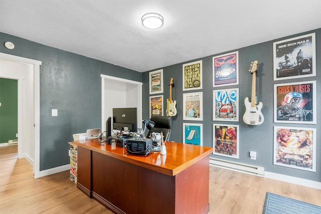 606 S Avenue W, Missoula, MT 59801 - office space featuring wood finished floors, a textured wall, baseboard heating, and baseboards