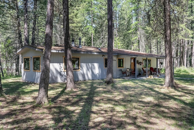 785 La Brant Rd, Bigfork, MT 59911 - rear view of house with a lawn