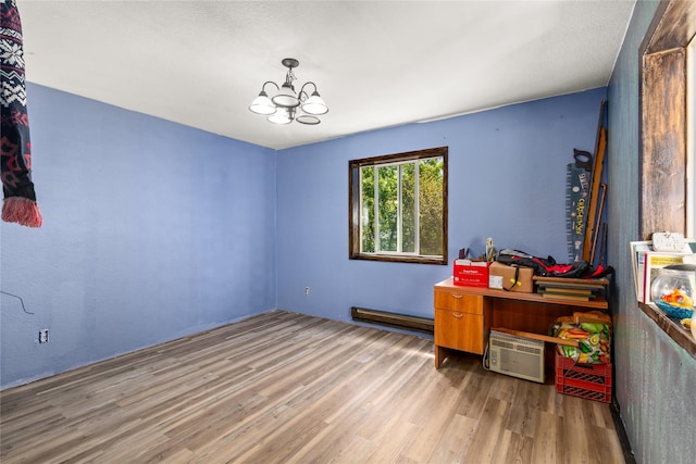1319 3rd St, Whitefish, MT 59937 - home office with wood finished floors, a chandelier, and a baseboard radiator