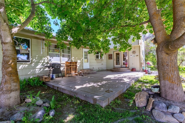 1319 3rd St, Whitefish, MT 59937 - view of patio featuring a grill, entry steps, and a deck