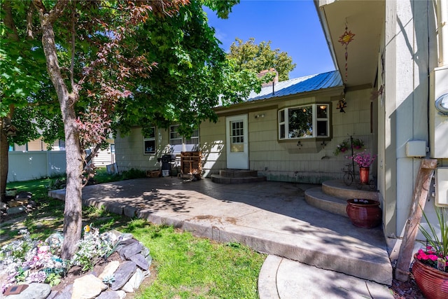 1319 3rd St, Whitefish, MT 59937 - doorway to property with a patio and metal roof