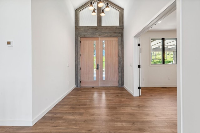 148 Blacktail Loop, Lakeside, MT 59922 - foyer featuring a chandelier, baseboards, and wood finished floors