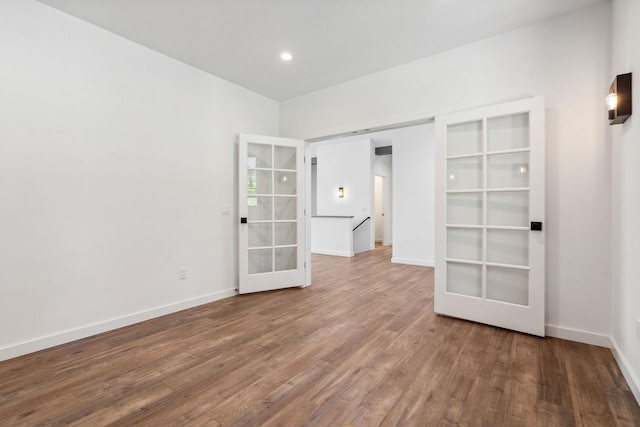 148 Blacktail Loop, Lakeside, MT 59922 - unfurnished bedroom with french doors, wood finished floors, baseboards, and recessed lighting