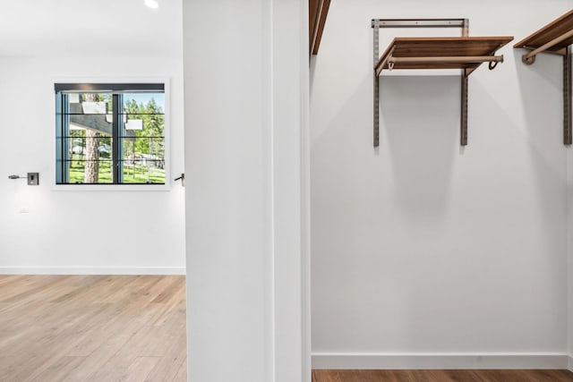 148 Blacktail Loop, Lakeside, MT 59922 - walk in closet featuring wood finished floors