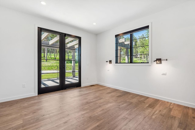 148 Blacktail Loop, Lakeside, MT 59922 - spare room with wood finished floors, baseboards, and recessed lighting