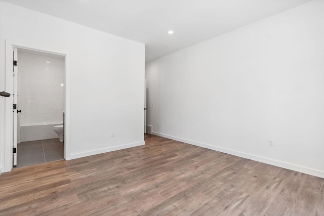 148 Blacktail Loop, Lakeside, MT 59922 - unfurnished room featuring wood finished floors, recessed lighting, and baseboards