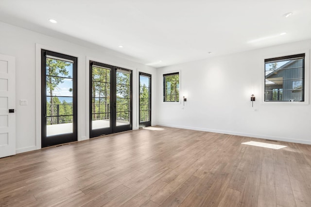 148 Blacktail Loop, Lakeside, MT 59922 - spare room with french doors, light wood-type flooring, baseboards, and recessed lighting