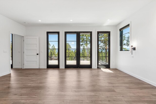 148 Blacktail Loop, Lakeside, MT 59922 - doorway to outside with wood finished floors, recessed lighting, and french doors