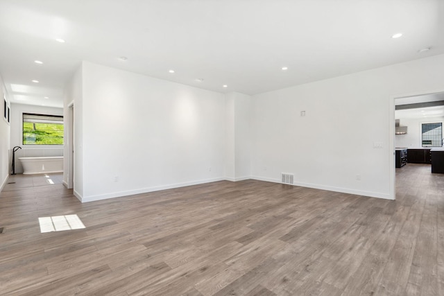 148 Blacktail Loop, Lakeside, MT 59922 - spare room featuring light wood-style flooring, recessed lighting, and baseboards