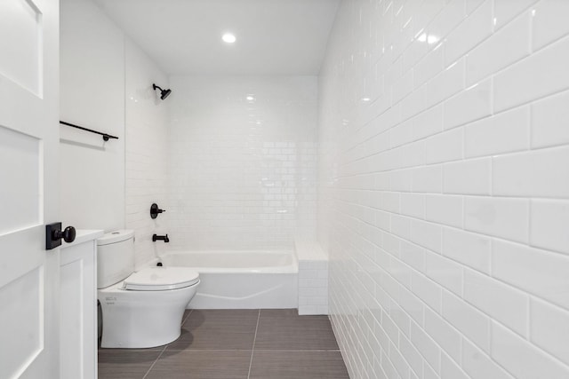 148 Blacktail Loop, Lakeside, MT 59922 - bathroom with toilet, tile patterned floors, shower / tub combination, and tile walls