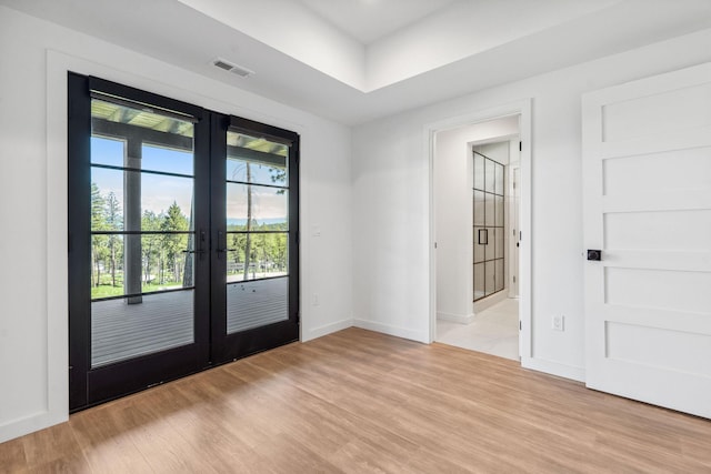 148 Blacktail Loop, Lakeside, MT 59922 - entryway featuring french doors, light wood finished floors, and baseboards