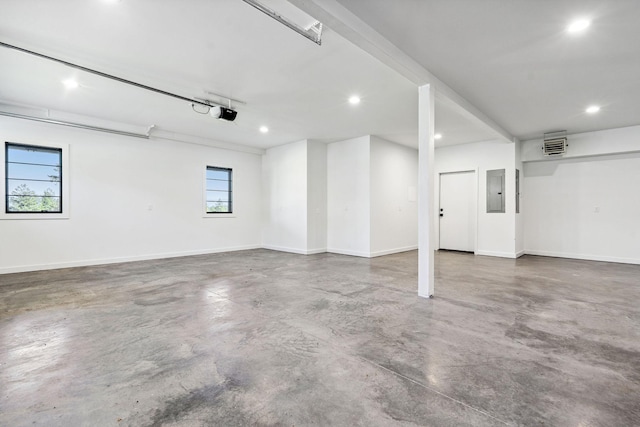 148 Blacktail Loop, Lakeside, MT 59922 - garage featuring recessed lighting, baseboards, electric panel, and a garage door opener