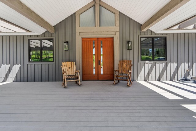 148 Blacktail Loop, Lakeside, MT 59922 - entrance to property with board and batten siding and a porch