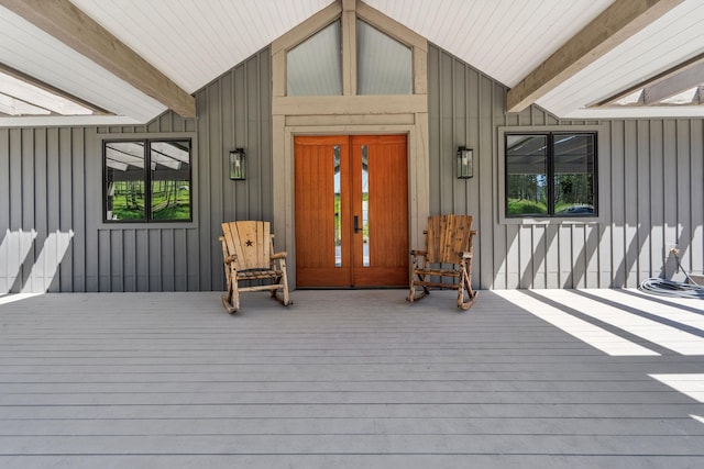 148 Blacktail Loop, Lakeside, MT 59922 - entrance to property featuring board and batten siding and a porch