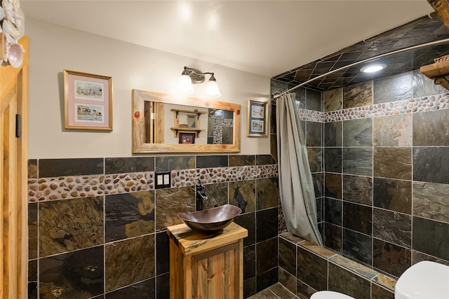 2700 Lyon Creek Rd, Missoula, MT 59804 - full bathroom with tile walls, vanity, and a wainscoted wall