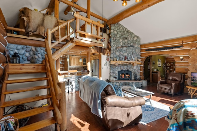 2700 Lyon Creek Rd, Missoula, MT 59804 - living room with arched walkways, rustic walls, high vaulted ceiling, beamed ceiling, and wood finished floors