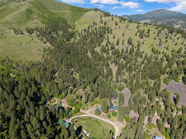 2700 Lyon Creek Rd, Missoula, MT 59804 - aerial view of property's location with mountains and a heavily wooded area