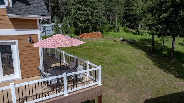 115 Wagon Wheel Rd, Whitefish, MT 59937 - view of green lawn with a wooden deck