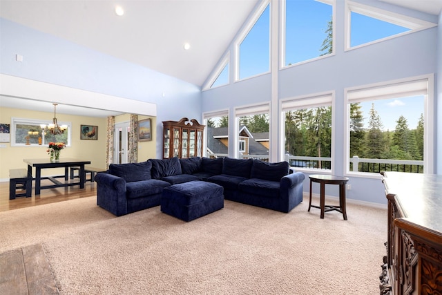 115 Wagon Wheel Rd, Whitefish, MT 59937 - carpeted living room featuring high vaulted ceiling, a chandelier, and recessed lighting