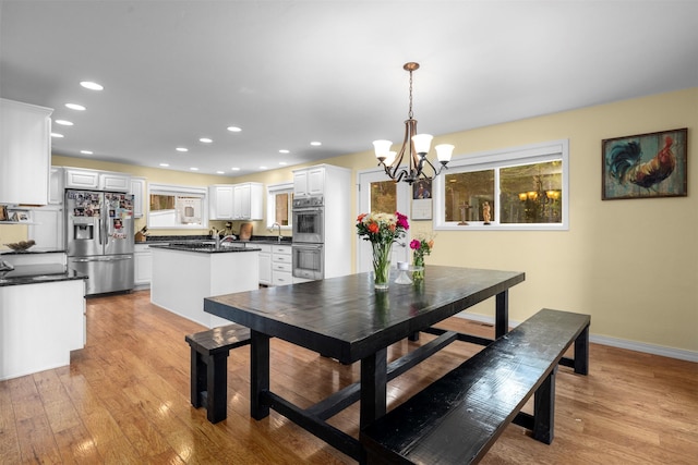 115 Wagon Wheel Rd, Whitefish, MT 59937 - dining room with a chandelier, light wood-style flooring, and recessed lighting