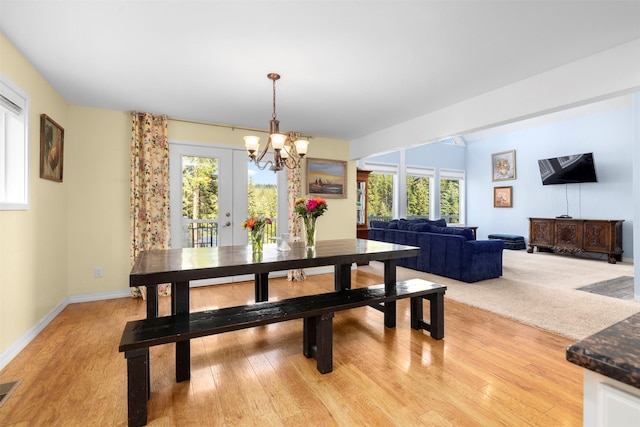 115 Wagon Wheel Rd, Whitefish, MT 59937 - dining room with a chandelier, plenty of natural light, and light wood-style flooring