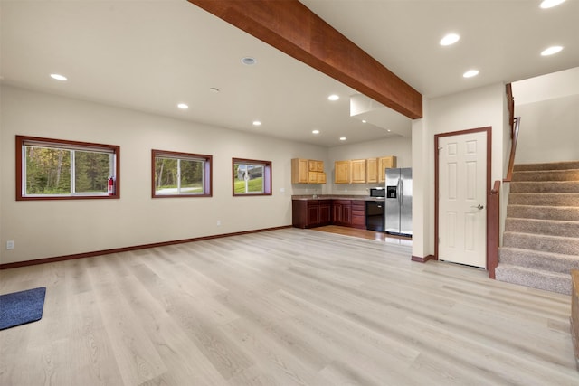 115 Wagon Wheel Rd, Whitefish, MT 59937 - unfurnished living room featuring recessed lighting, stairway, light wood-type flooring, and beamed ceiling
