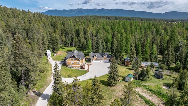 115 Wagon Wheel Rd, Whitefish, MT 59937 - view from above of property with a heavily wooded area and a mountainous background
