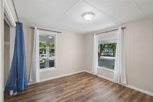 44 5th Ave E, Kalispell, MT 59901 - spare room featuring wood finished floors, baseboards, and a paneled ceiling