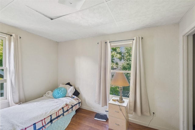 44 5th Ave E, Kalispell, MT 59901 - bedroom featuring wood finished floors, multiple windows, and baseboards