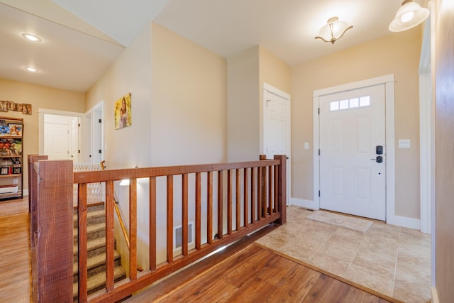 7567 Kingpost Loop, Helena, MT 59602 - entrance foyer with wood finished floors, baseboards, and recessed lighting