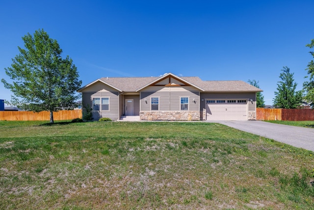 7567 Kingpost Loop, Helena, MT 59602 - ranch-style house featuring an attached garage, asphalt driveway, and stone siding