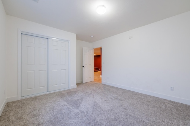 7567 Kingpost Loop, Helena, MT 59602 - unfurnished bedroom with light colored carpet, baseboards, and a closet