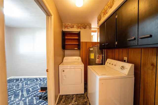 411 Colorado Ave, Libby, MT 59923 - laundry area featuring cabinet space, water heater, independent washer and dryer, and baseboards