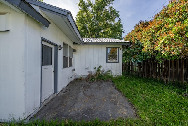 411 Colorado Ave, Libby, MT 59923 - view of property exterior featuring a patio area, metal roof, and board and batten siding