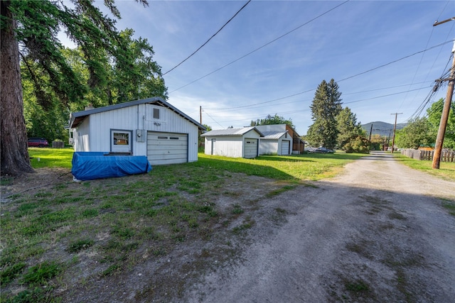 411 Colorado Ave, Libby, MT 59923 - detached garage with dirt driveway