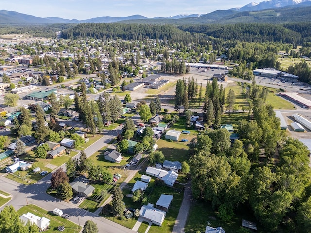 411 Colorado Ave, Libby, MT 59923 - aerial view of property and surrounding area with a mountainous background and a forest