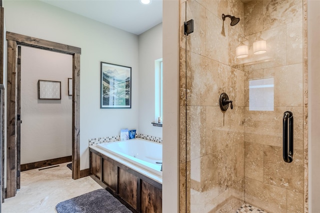 224 Forest Edge Trl, Kalispell, MT 59901 - full bathroom with a shower stall, a bath, and baseboards