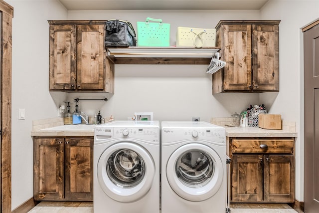 224 Forest Edge Trl, Kalispell, MT 59901 - laundry room featuring cabinet space, independent washer and dryer, and baseboards