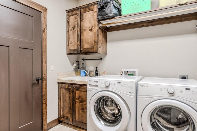 224 Forest Edge Trl, Kalispell, MT 59901 - laundry room featuring washer and clothes dryer and cabinet space