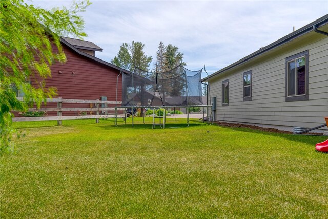 224 Forest Edge Trl, Kalispell, MT 59901 - view of green lawn featuring a trampoline