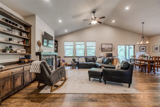 224 Forest Edge Trl, Kalispell, MT 59901 - living area with a fireplace, a chandelier, ceiling fan, dark wood-style floors, and recessed lighting