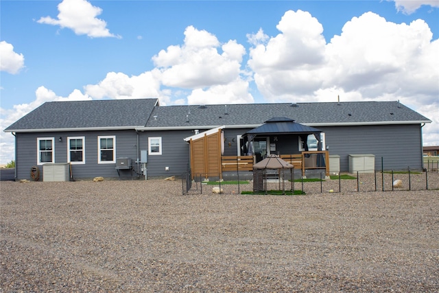 7220 2nd St NW, Havre, MT 59501 - back of house featuring a gazebo and a shingled roof