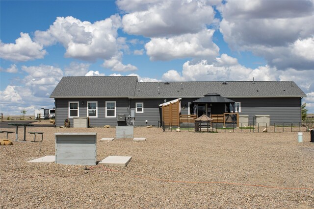 7220 2nd St NW, Havre, MT 59501 - back of house featuring a gazebo and roof with shingles