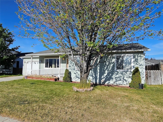 548 N Daly Ave, Hamilton, MT 59840 - view of front of house with an attached garage, concrete driveway, and covered porch