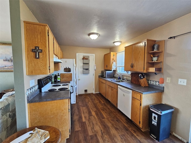 548 N Daly Ave, Hamilton, MT 59840 - kitchen with dishwasher, under cabinet range hood, stainless steel microwave, dark countertops, and dark wood-type flooring