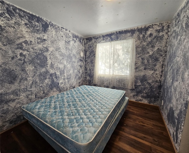 548 N Daly Ave, Hamilton, MT 59840 - bedroom featuring wood finished floors and wallpapered walls
